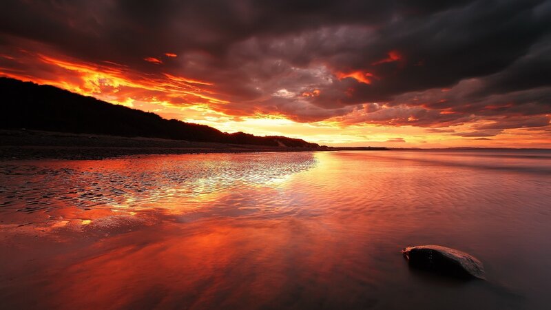 Sunset over Beach — Orange, Dramatic, Photograph, Clouds, Sea, Rock