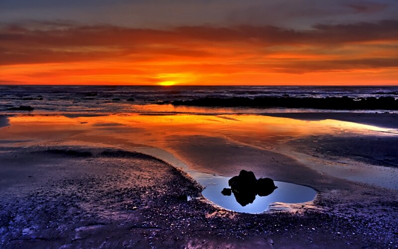 Sunset over Beach — Orange, Dramatic, Photograph, Ocean, Rocks, Sky