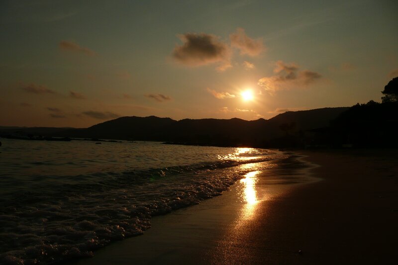 Sunset over Beach — Orange, Serene, Photograph, Mountains, Ocean