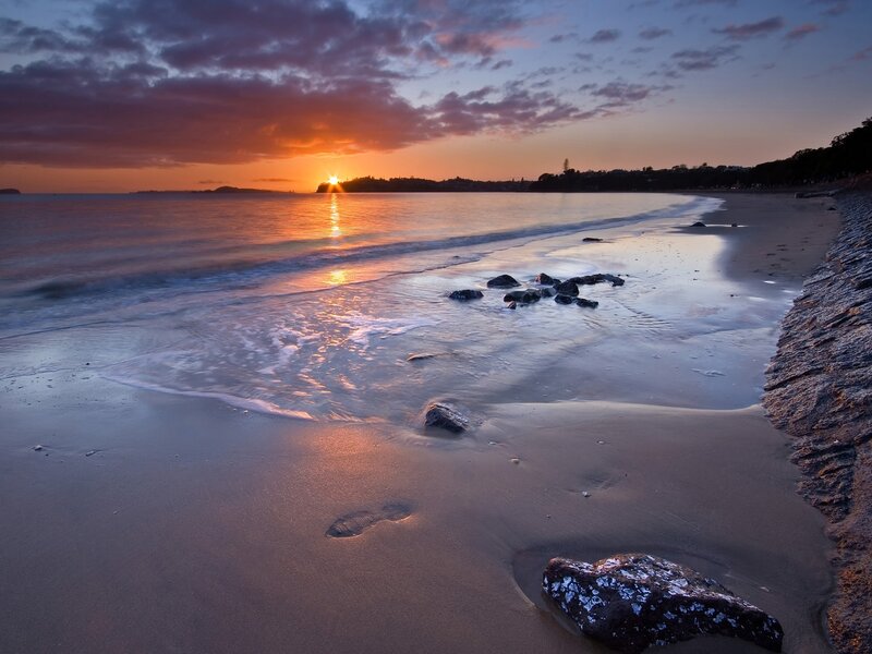Sunset over Beach — Orange, Serene, Photograph, Ocean, Rocks, Footprint