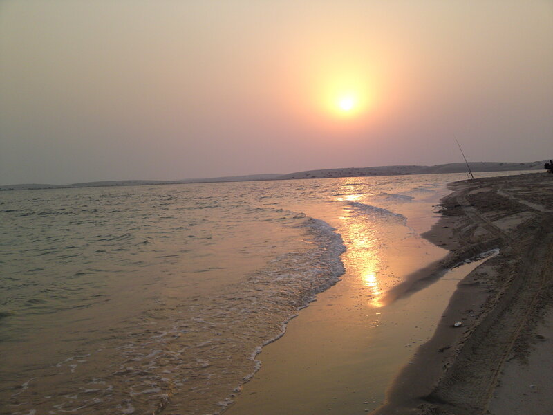 Sunset over Beach — Orange, Serene, Photograph, Sun, Ocean, Sand, Fishing Rod