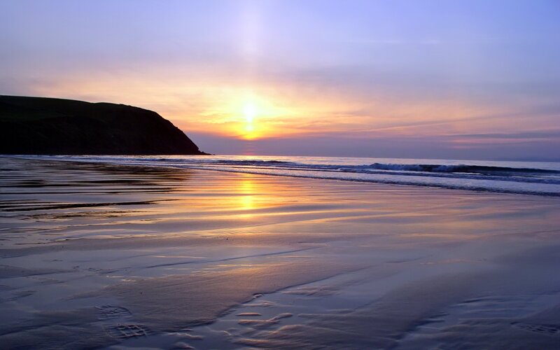 Sunset over Beach — Yellow, Serene, Photograph, Cliff