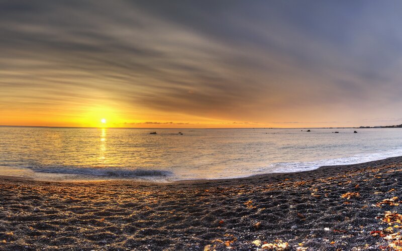 Sunset over Black Sand Beach — Yellow, Serene
