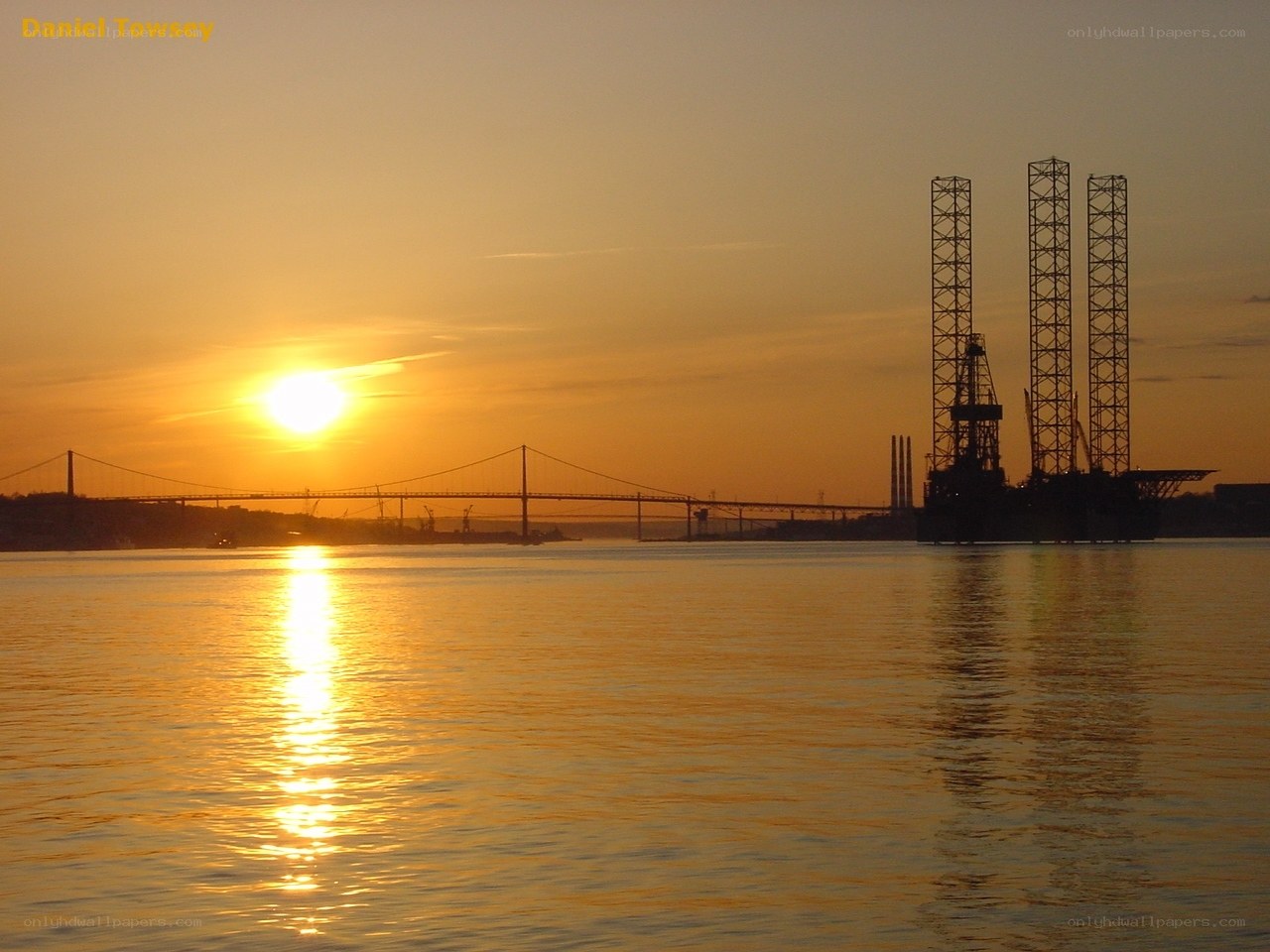 Sunset over bridge and rig