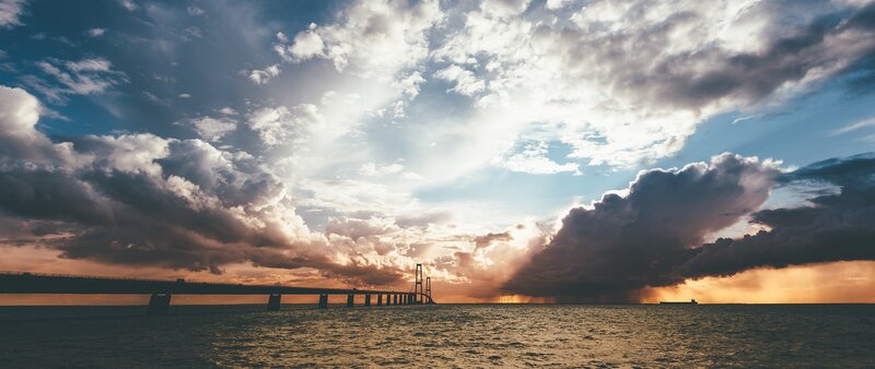 Sunset over Bridge — Blue, Dramatic, Photograph, Clouds, Sea