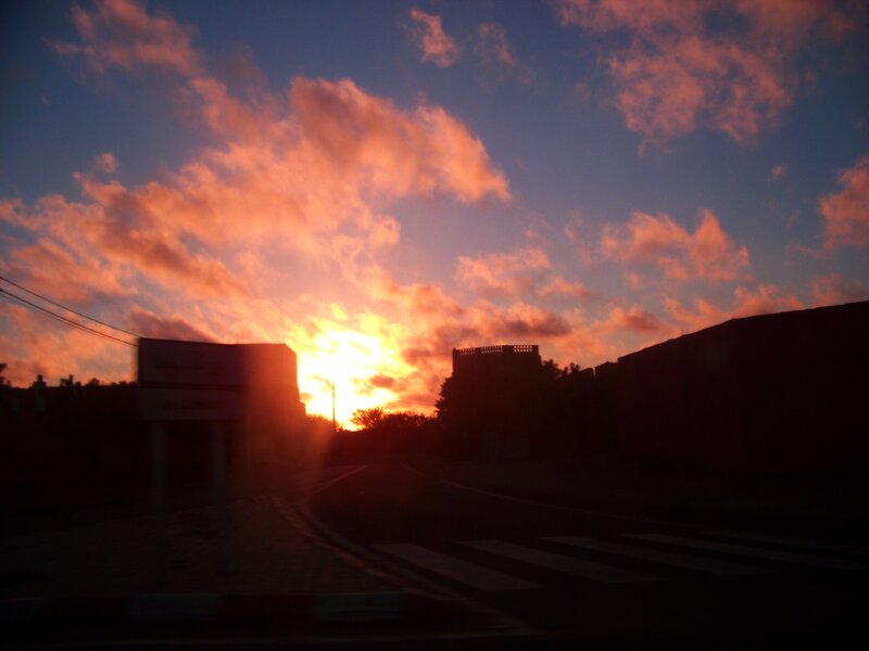 Sunset over Buildings — Orange, Dramatic, Photograph, Road
