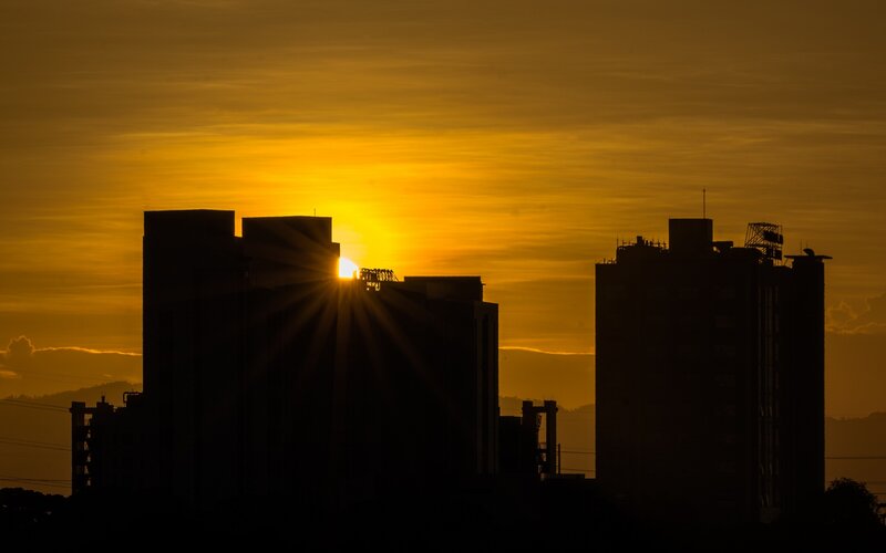 Sunset over Buildings — Yellow, Dramatic