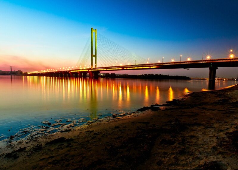 Sunset over Cable-stayed Bridge — Blue, Serene, Photograph, River, Sky