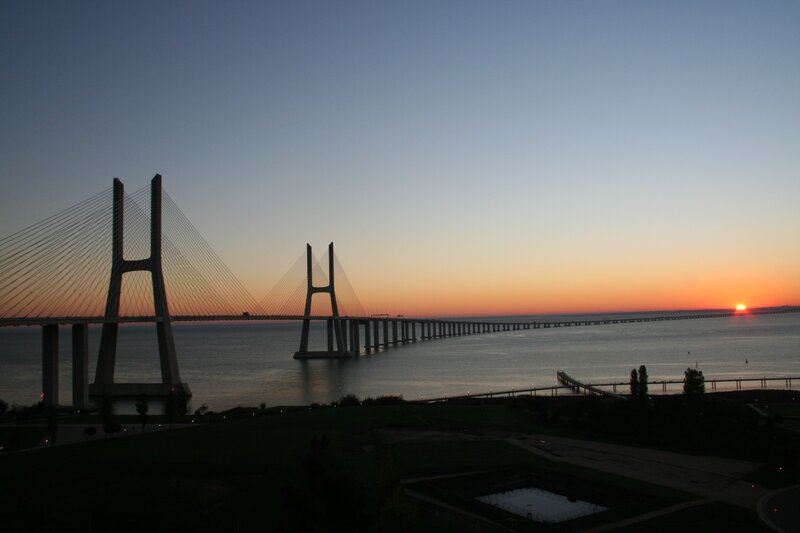 Sunset over Cable-stayed Bridge — Blue, Serene, Photograph, Sea