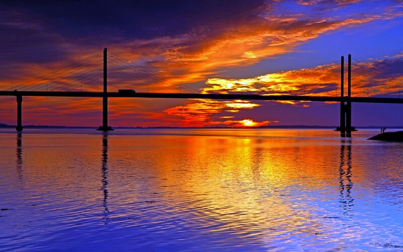 Sunset over Cable-stayed Bridge — Orange, Dramatic, Photograph, Sky