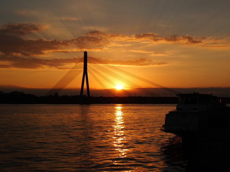 Sunset over Cable-stayed Bridge — Orange, Serene, Photograph, Boat
