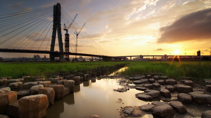 Sunset over Cable-stayed Bridge — Orange, Serene, Photograph, Cranes, River