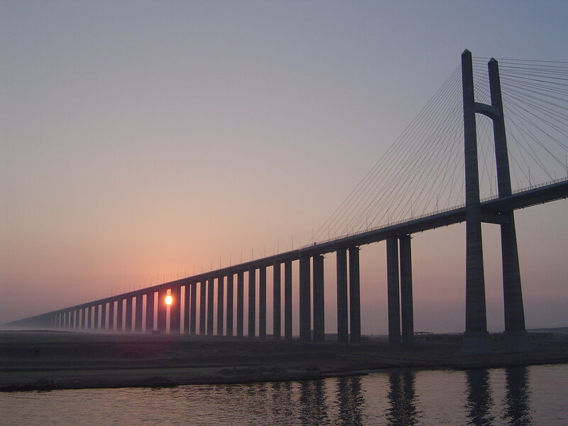 Sunset over Cable-stayed Bridge — Orange, Serene, Photograph, Sun, River