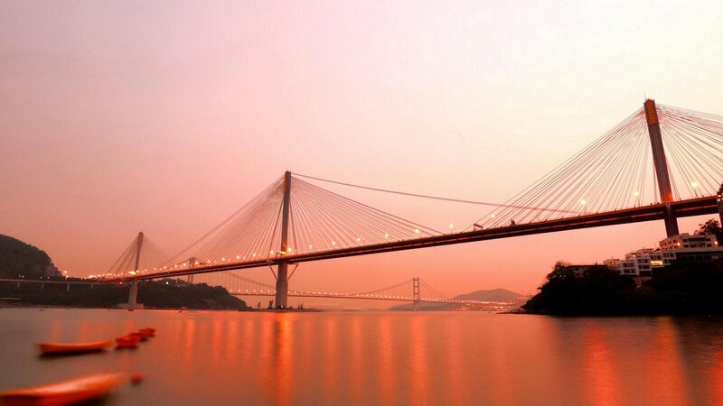 Sunset over Cable-stayed Bridge — Orange, Serene, Photograph, Water, Boats