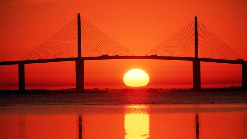 Sunset over Cable-stayed Bridge — Red, Dramatic, Photograph, Sun, Water, Birds