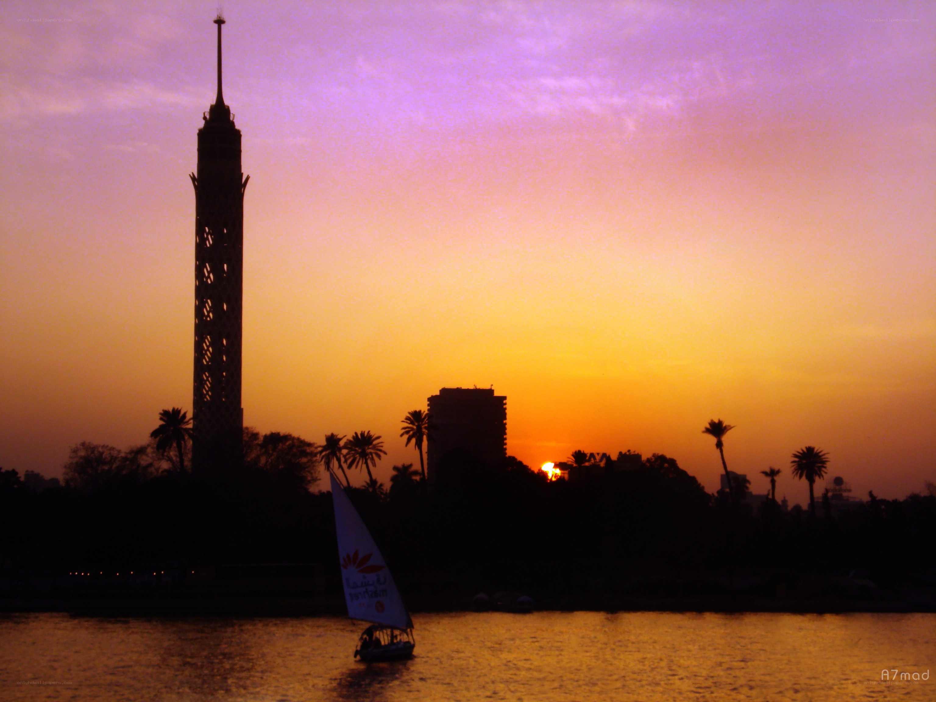 sunset over cairo with sailboat