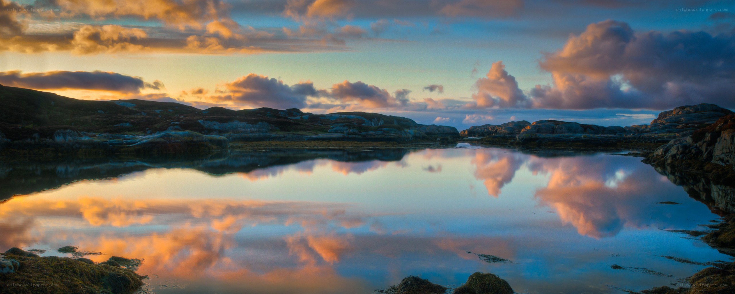 Sunset over calm coastal waters