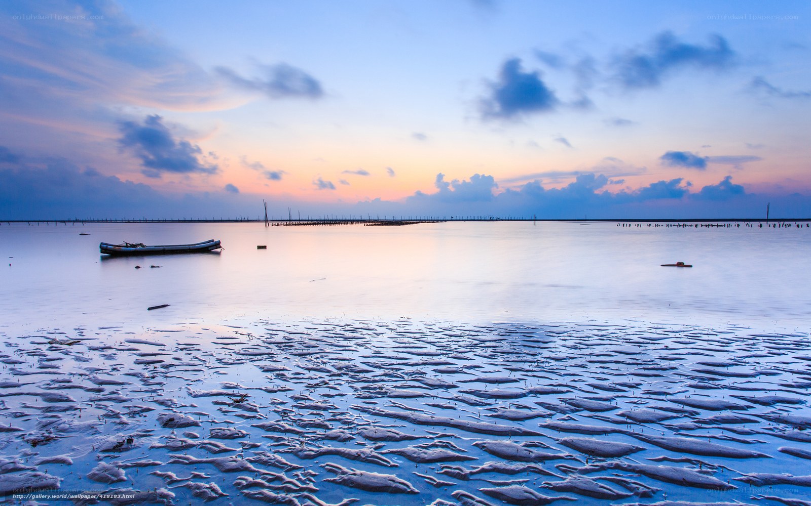 Sunset over calm coastal waters