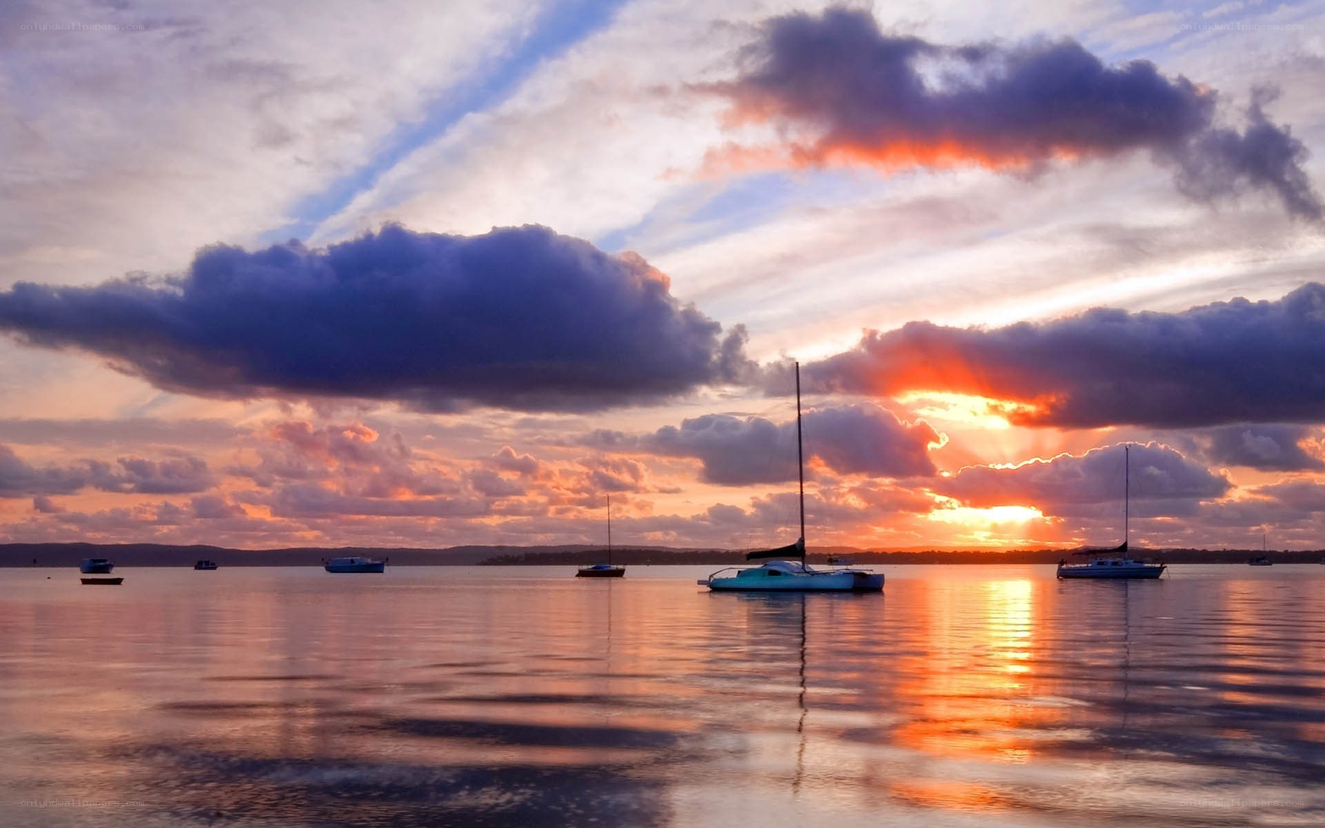 Sunset over calm harbor