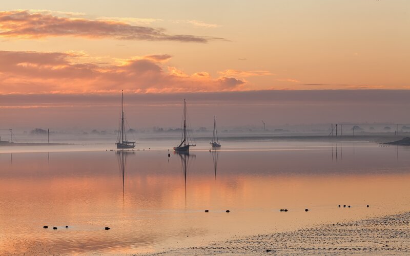 Sunset over calm harbor