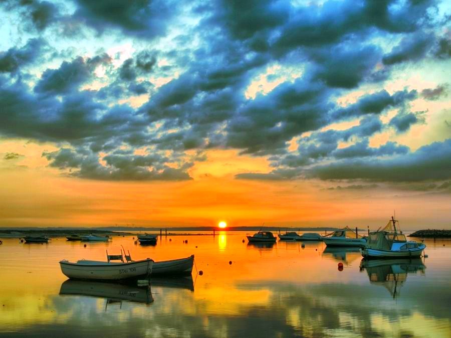 Sunset over calm harbor