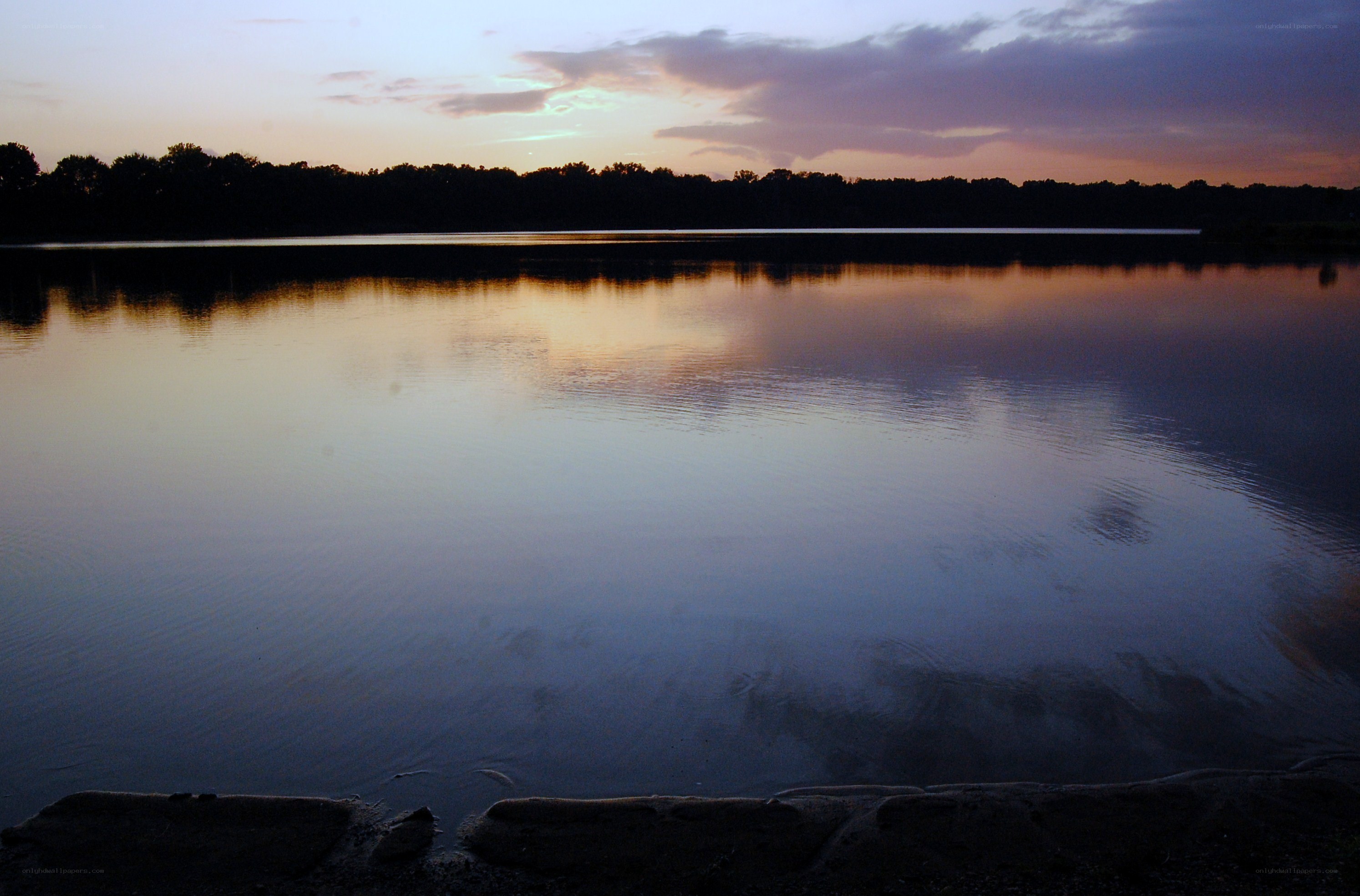 sunset over calm lake