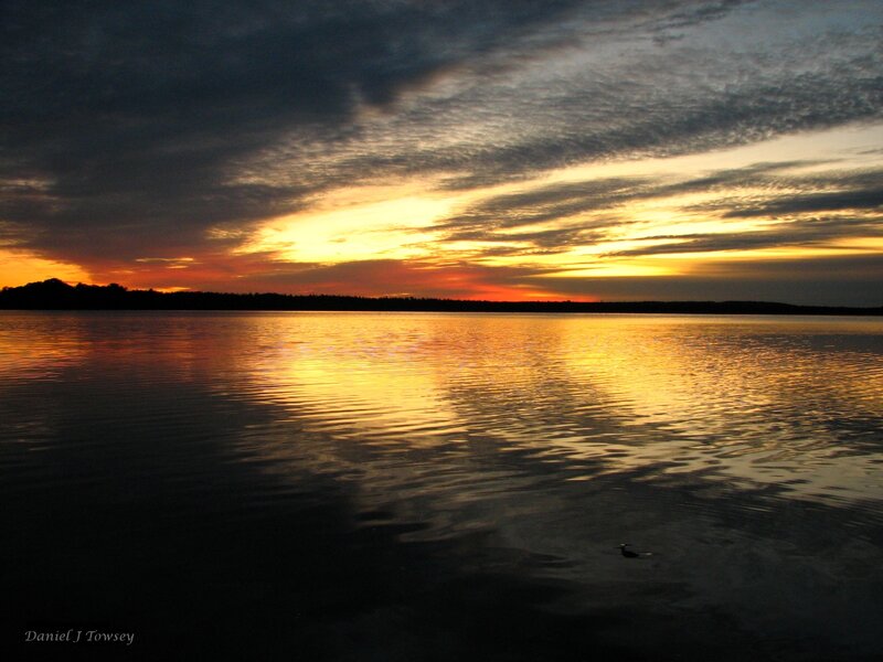 sunset over calm lake