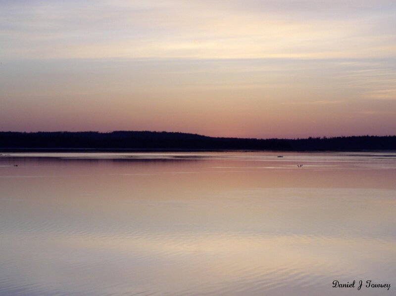sunset over calm lake