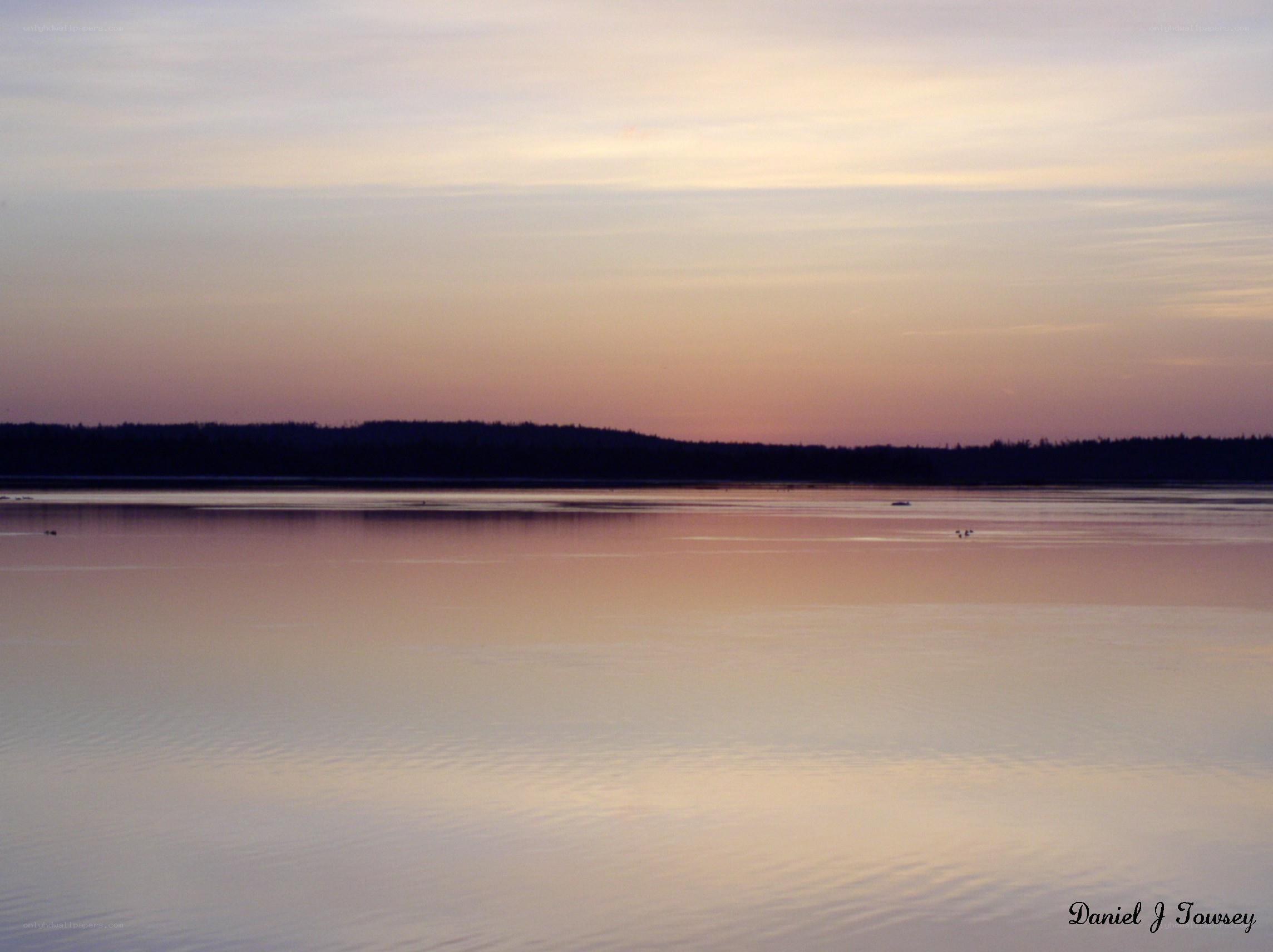 sunset over calm lake