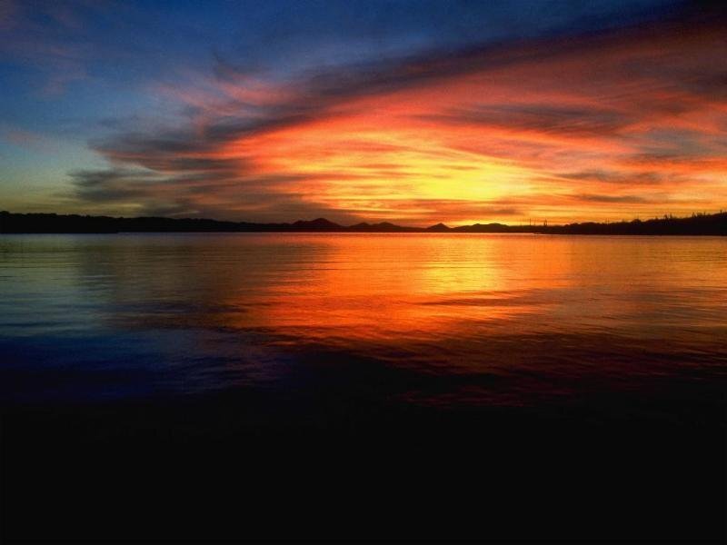 sunset over calm lake