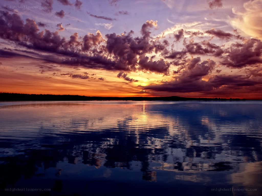 sunset over calm lake
