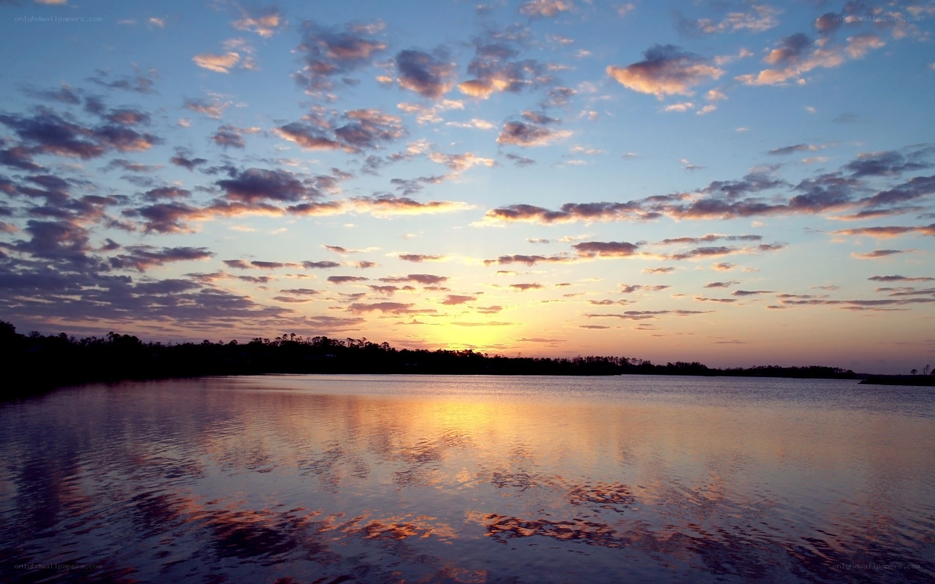 sunset over calm lake