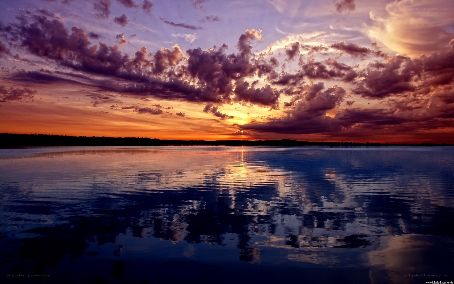 Sunset over calm lake