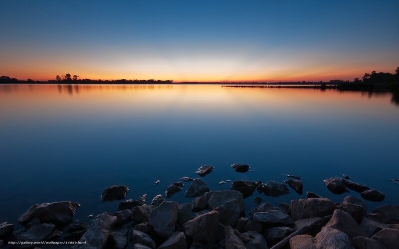 Sunset over calm lake