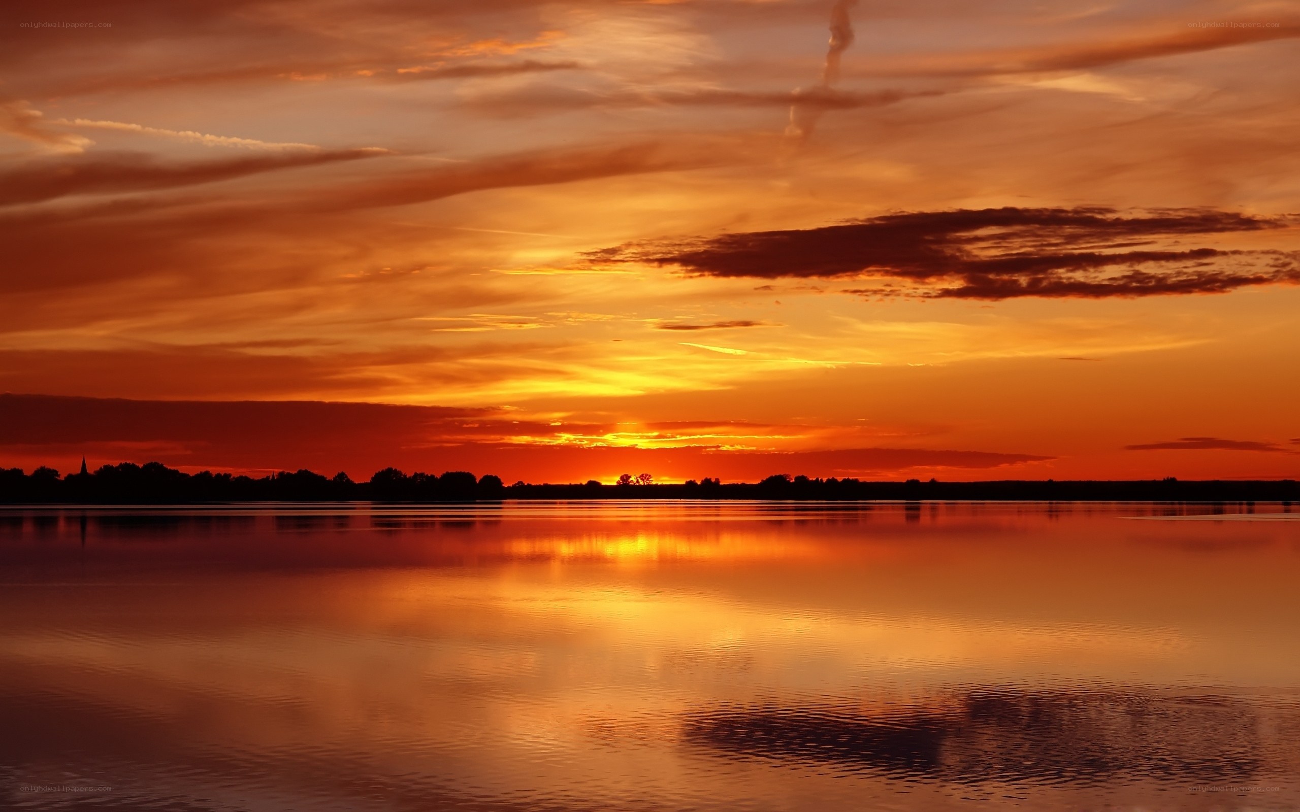 Sunset over calm lake