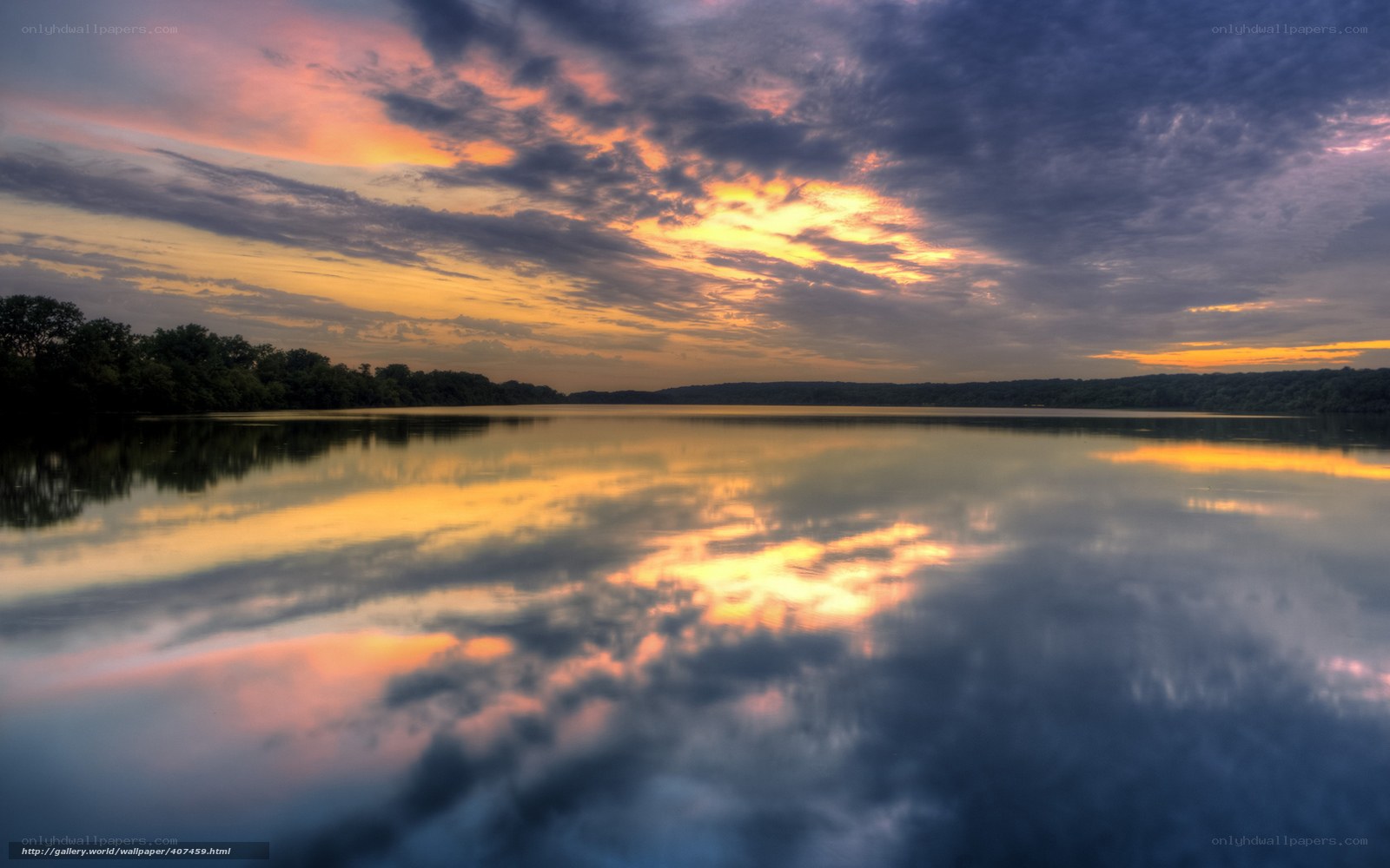 Sunset over calm lake