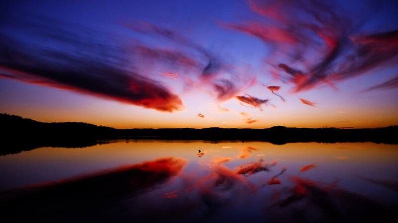 Sunset over calm lake