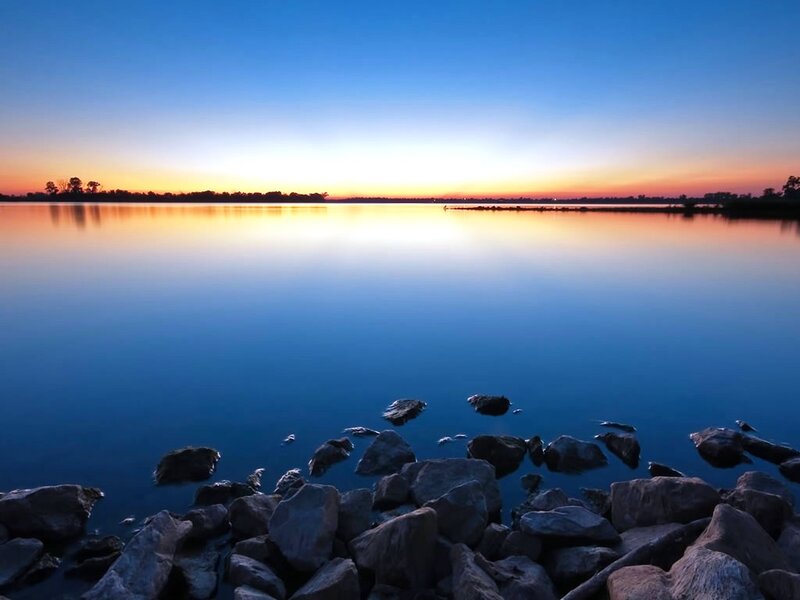 Sunset over calm lake