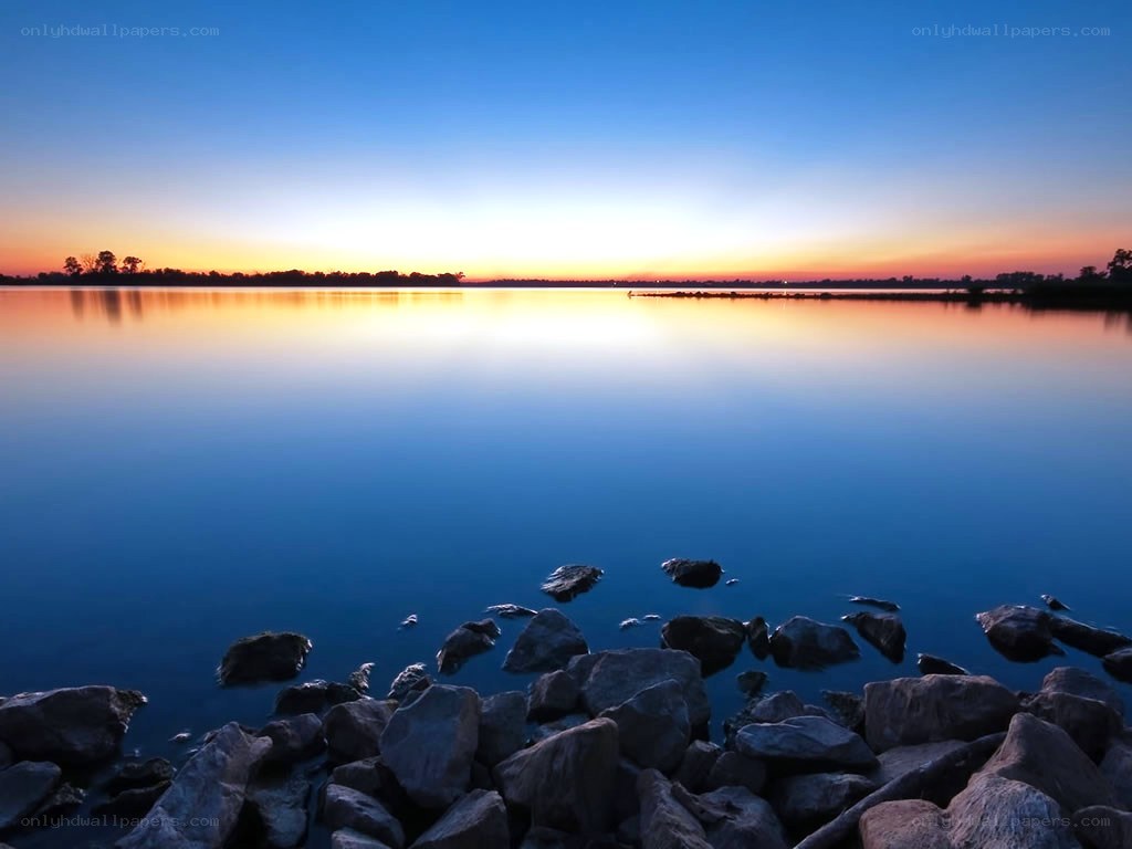Sunset over calm lake