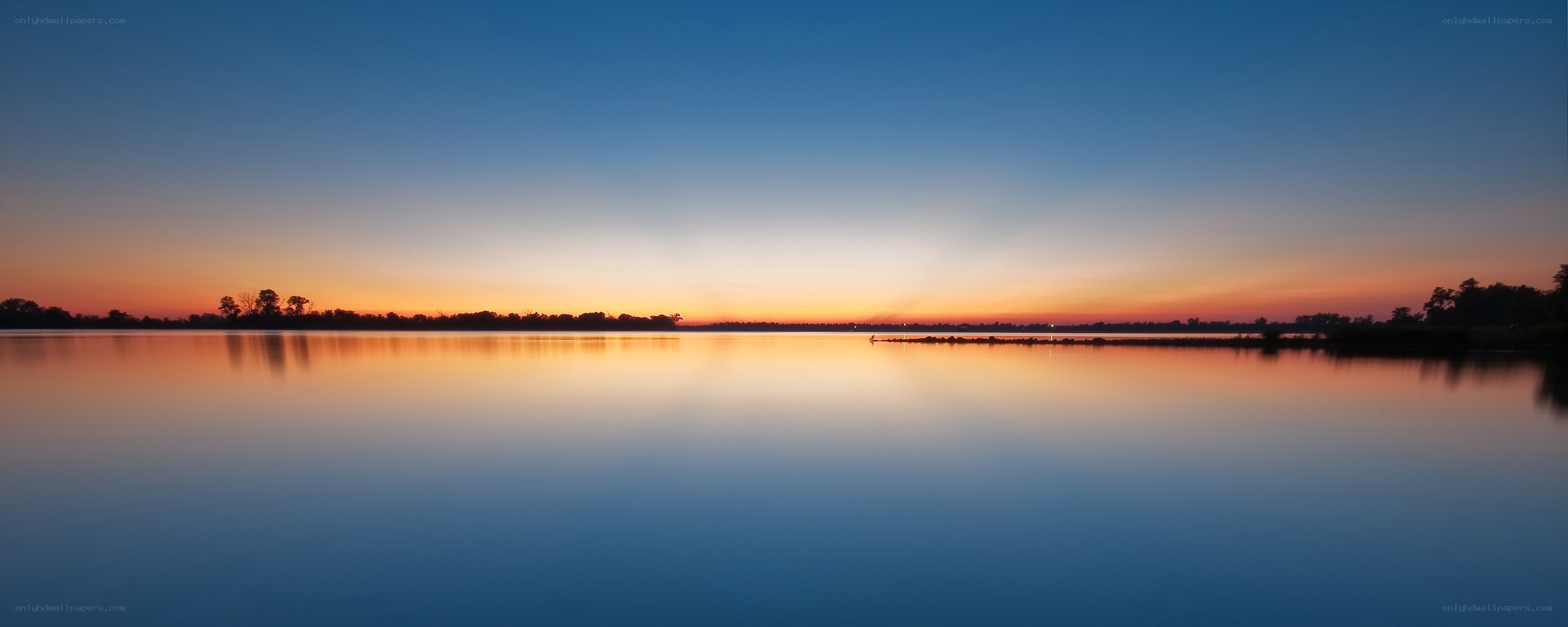 Sunset over calm lake