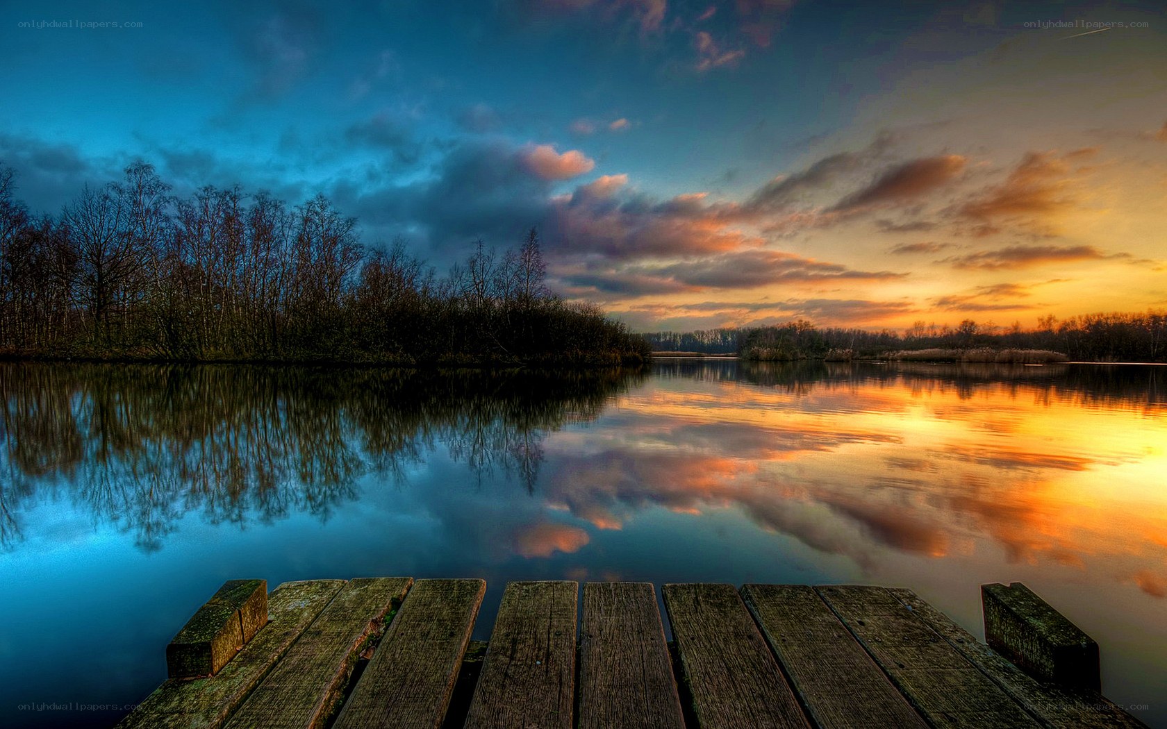 sunset over calm lake