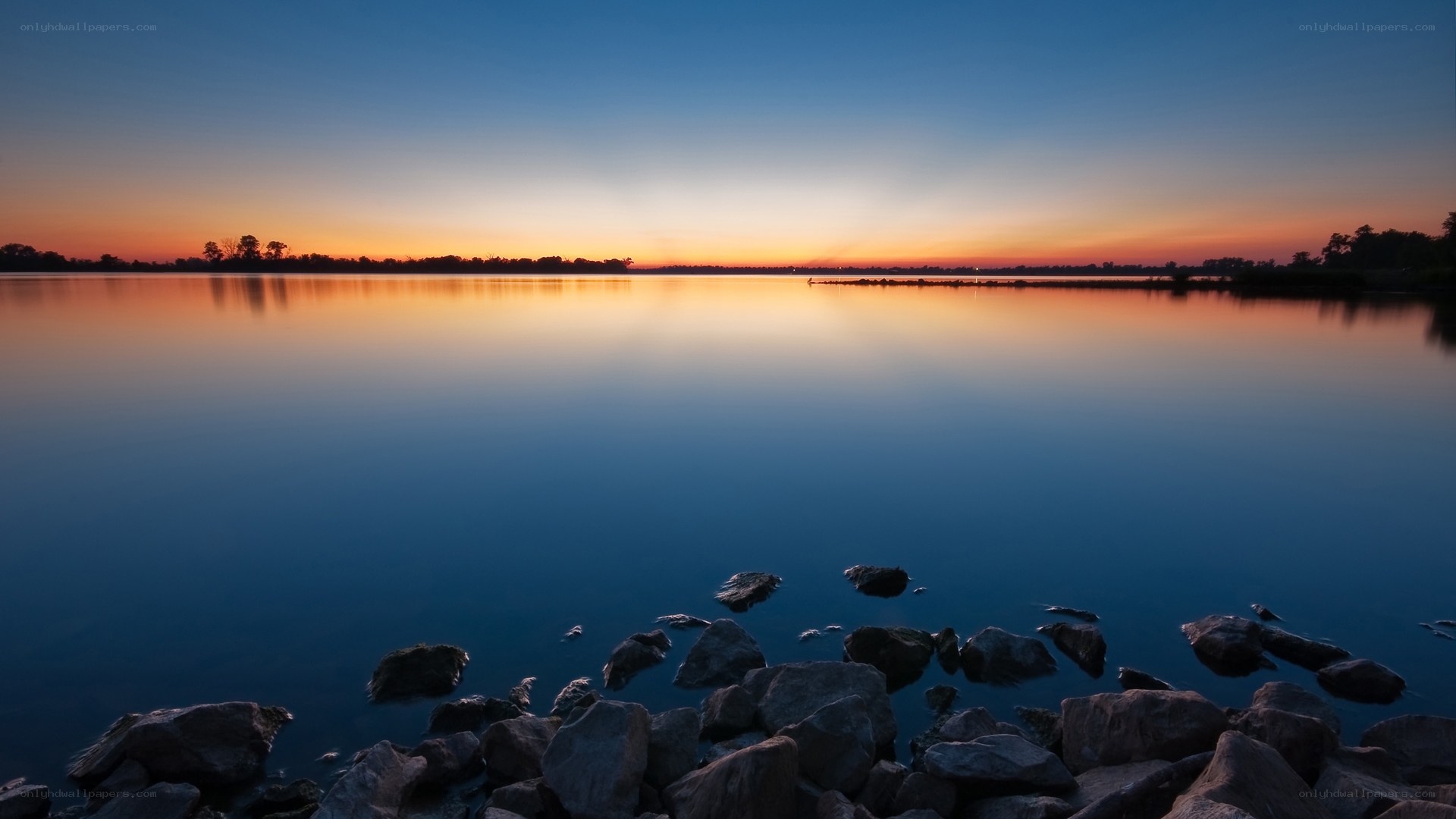 Sunset over calm lake