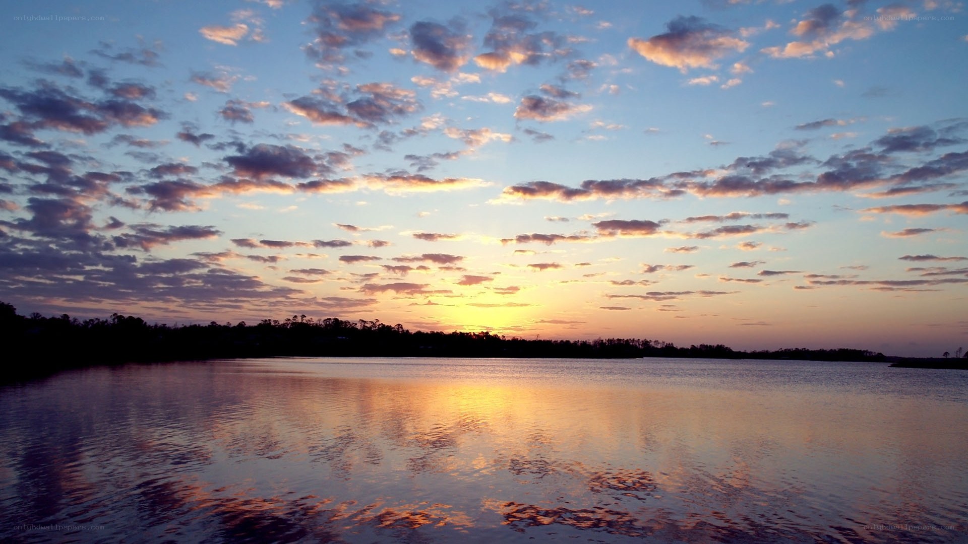 sunset over calm lake