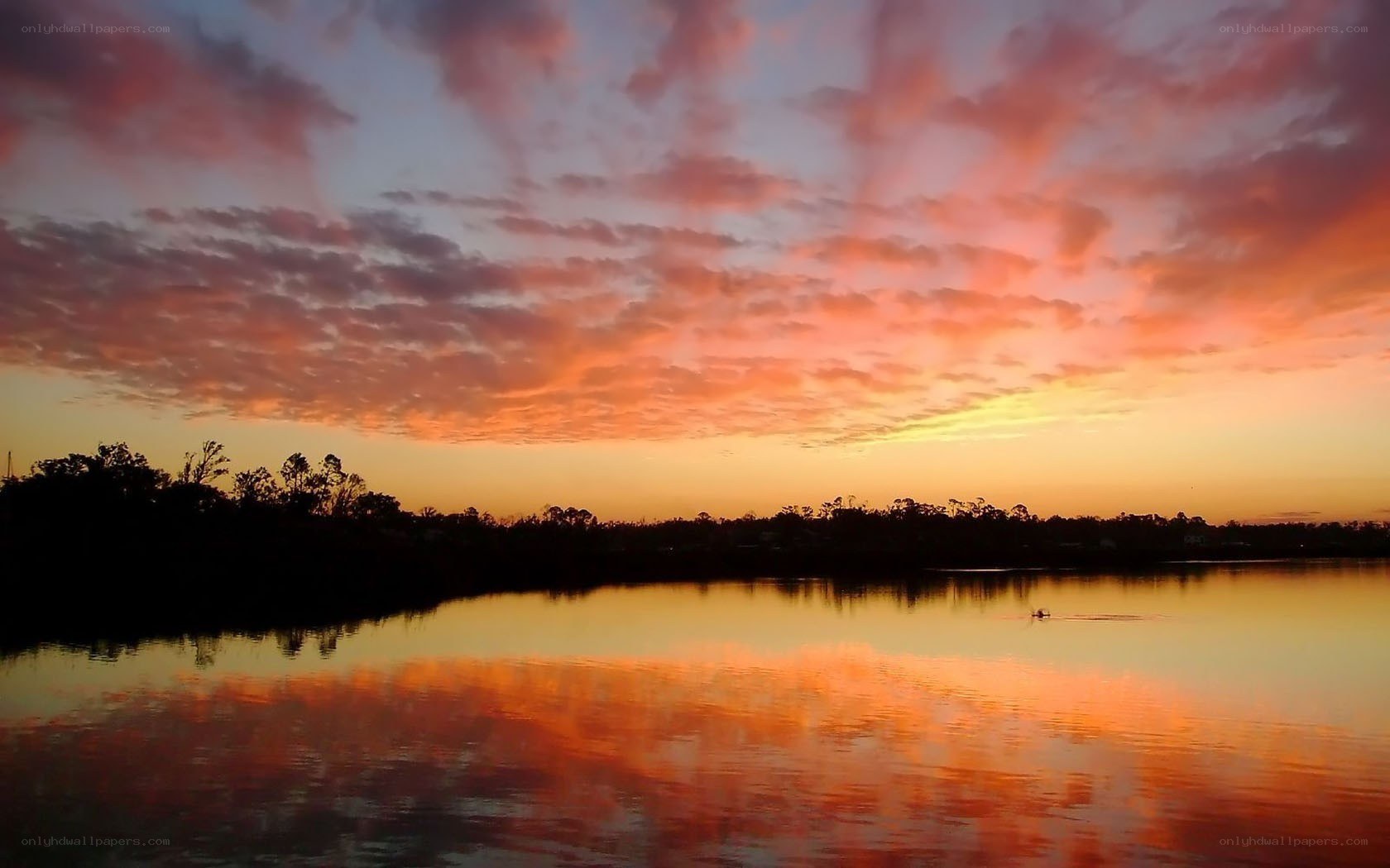 Sunset over calm lake