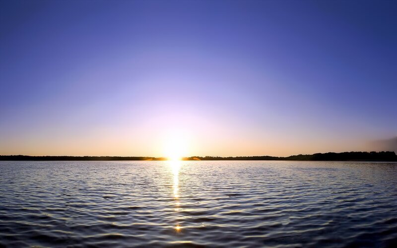 Sunset over calm lake