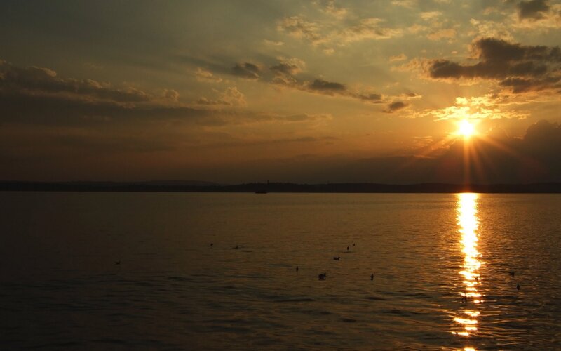 sunset over calm lake