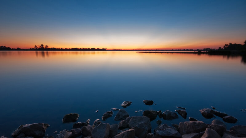Sunset over calm lake
