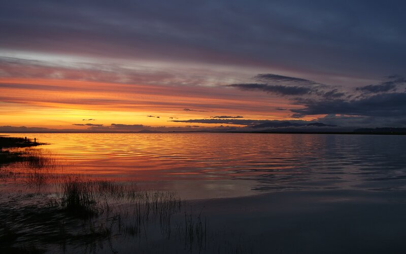 Sunset over calm lake
