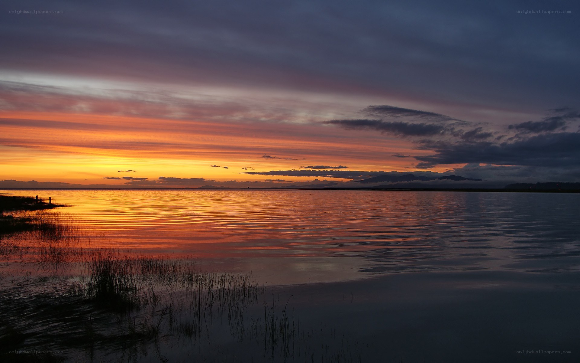 Sunset over calm lake