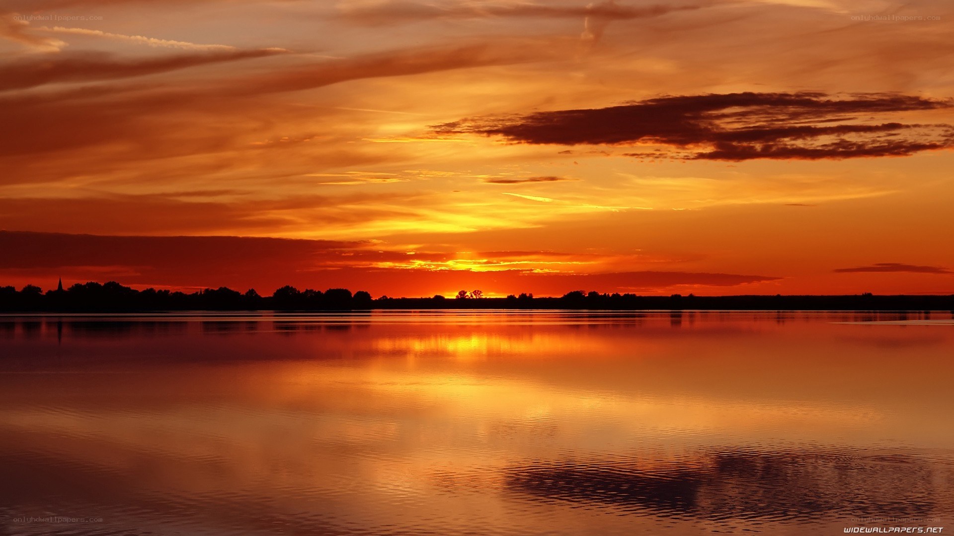 sunset over calm lake